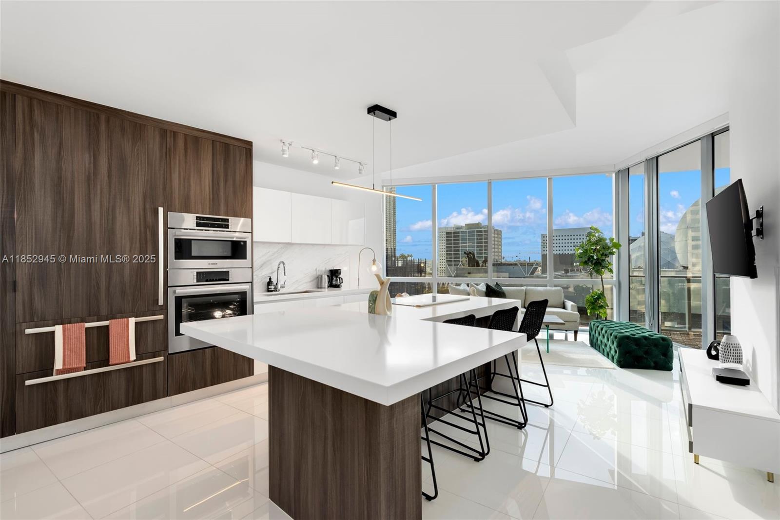 Beautiful residence featuring a primary bedroom with walk-in closets and spacious ensuite bathroom plus a fully enclosed den with its own bathroom-perfect as a guest suite and families. This sleek, modern luxury condo offers stunning sunset views in the heart of Miami Worldcenter, with retail, dining and cafes just steps away. Paramount Miami Worldcenter boasts an unmatched collection of amenities, including a boxing studio, indoor basketball court, resort-style pools, and much more. Experience Miami living at its finest!