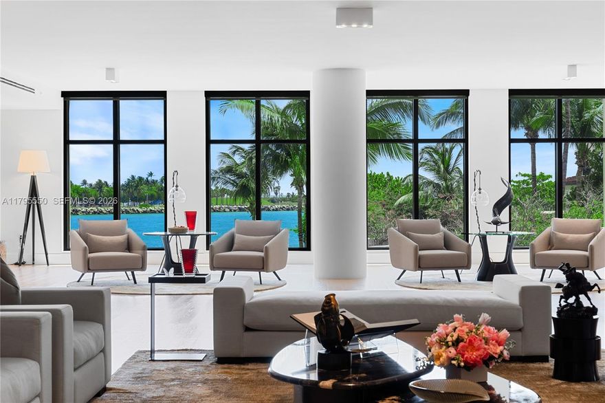 LUXURY IN MINIMALISM DESIGNED IN ELEGANT HUES OF GRAY & TAUPES IN THIS PALATIAL CORNER RESIDENCE WITH BAY VIEWS ON FISHER ISLAND’S PALAZZO DEL SOL! Oversized 7,630 SF of Pristine Interiors in an Armani Casa Vibe with Nearly 3,000 SF of Deep Wraparound Terraces. This 5 Bedroom + Study & 6.5 Bathroom Home is Exceptionally Maintained like New. 2 Private Elevators lead you to your Mammoth Bayfront Great Room with Elegant Formal Dining & Lounging Areas—Media Room with Sculptural Oak Louvers. Elegant White Boffi Kitchen showcases a stone Eat-in Island + Gaggenau Appliances & Temp-Controlled Wine Room & Pantry—adjacent Family Room with a Massive Terrace perfect for Entertaining. The Massive Primary Suite with Ocean-Facing Terrace features its own Office, Clad in Oak Millwork. Two Luxurious Custom Walk-in Closets. Primary Bathroom wrapped in Bookmatched Carrara Marble, Double Vanity Sink, & Boffi Soaking Tub & Rainshower. All Bedrooms feature En-suite Baths + Terraces with Lush Tropical Views. 2 Parking + 2 Golf Cart Spaces + Storage Unit.

Palazzo Del Sol is an Award-Winning Building by Kobi Karp, Antrobus Design, & ASR Construction. Building Amenities & Services include Butler-Serviced Aperitivo Bar & Lounge, Theater, Hair & Makeup Salon, Private Massage Rooms, Business Center, Gym & Cardio Room, Kidville Playroom, Concierge, Valet, Zero-Edge Pool & Spa with Attendant.