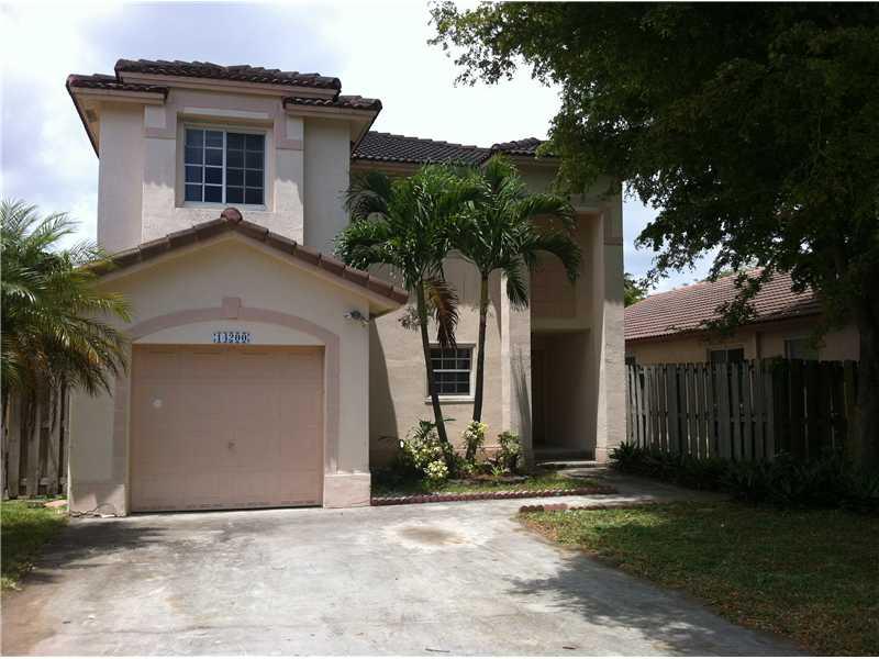 Fantastic two story house with 3 bedrooms, 2 baths, huge master bath, walk-in closets, tile downstairs and wood laminate flooring up. Huge house offers florida room and garage. Great location near Country Walk in Kendall. Great schools, shopping and din ing. GATED COMMUNITY with pool, etc. Easy to show and ready to go.