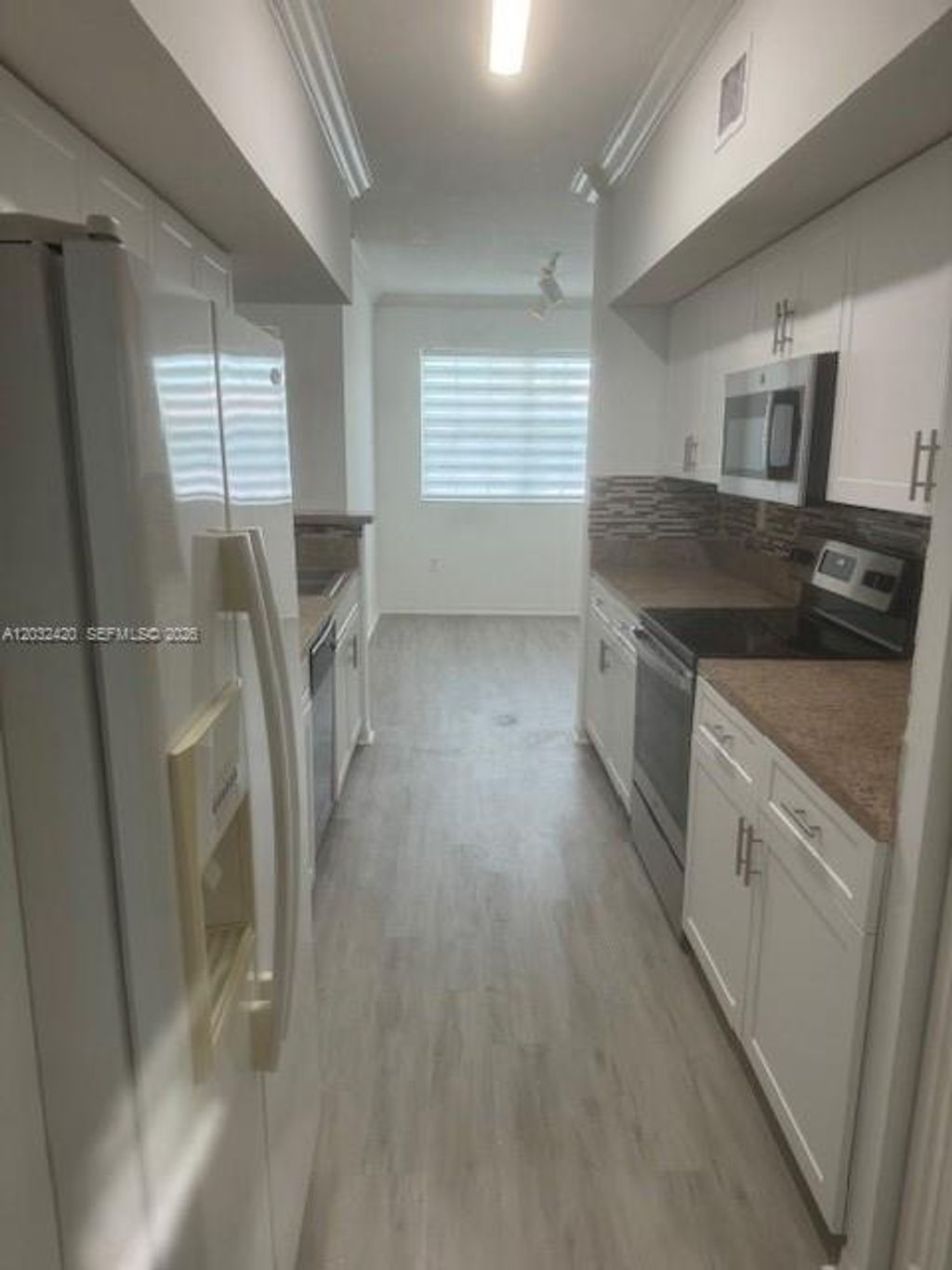 Photo of 140 SW 117th Ave #4301, Pembroke Pines, FL 33025 (MLS # A12032420)
