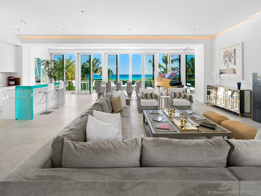 A rare opportunity to own one of the few private houses directly on the ocean in Miami Beach. Located in Altos Del Mar, this oceanfront single-family contemporary home was built by Coastal Construction and features spectacular ocean views spread over 3 floors. An interior courtyard entry features a decorative waterfall descending from a bridge above and majestic glass curtainwall with views of the staircase. Large living spaces on two floors include a more casual first floor with direct access to the saltwater pool, hot tub, large backyard, and ocean through a sliding glass wall, and a 45’x45’ grand entertaining space on the second floor with fireplace, formal dining, 11’ ceilings, and large terrace. The third-floor master suite has 14’ ceilings and a private terrace overlooking the ocean.