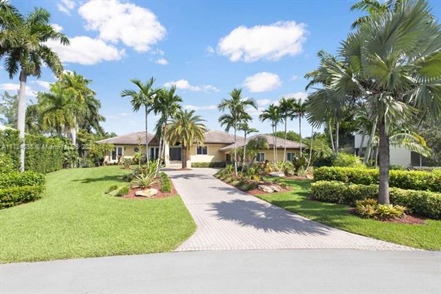 Privacy, security, and ocean access in this one-of-a-kind Coral Gables estate situated at the end of the road on one of the largest lots in the prestigious guard-gated Hammock Oaks. An entertainer's dream! This bright single-story home with attached three car garage has an open floor plan with 20ft ceilings, custom millwork, and marble and Brazilian Teak flooring throughout. It is a 5/5 plus office, zoned for Pinecrest schools, and features wet bar, 300 bottle wine cooler, and dedicated laundry room. Step outside any of the home's custom hurricane resistant doors to enjoy the summer kitchen, oversized saline pool with jacuzzi, and 65ft deeded seawall and dock with weatherproof composite decking, water, and electricity. Truly a boater's paradise with access to Biscayne Bay in minutes!