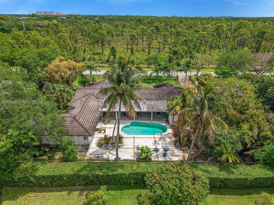 Tucked away in one of Palmetto Bay’s most coveted pockets, this spacious 5-bedroom, 4-bath residence offers the ideal blend of comfort, privacy, and location. Set behind gates on a quiet, tree-lined street shared with the iconic Chinese Bridge and just moments from the historic Charles Deering Estate, the home enjoys serene views of the Deering Preserve—bringing a rare sense of nature and tranquility right to your backyard. Designed for family living, the layout features generous living spaces plus a versatile media room or home office, perfect for today’s flexible lifestyle. The home exudes warmth throughout, with a welcoming, “homey” feel that’s hard to find in rental properties of this size. Outdoors, enjoy lush surroundings and peaceful privacy, while still being just a short bike ride to Coral Reef Park. Ideally located near top private and public schools including Westminster, Palmer Trinity, and Coral Reef Elementary, this property offers both convenience and an exceptional lifestyle.
A true Palmetto Bay oasis—spacious, gated, and perfectly positioned for family living.