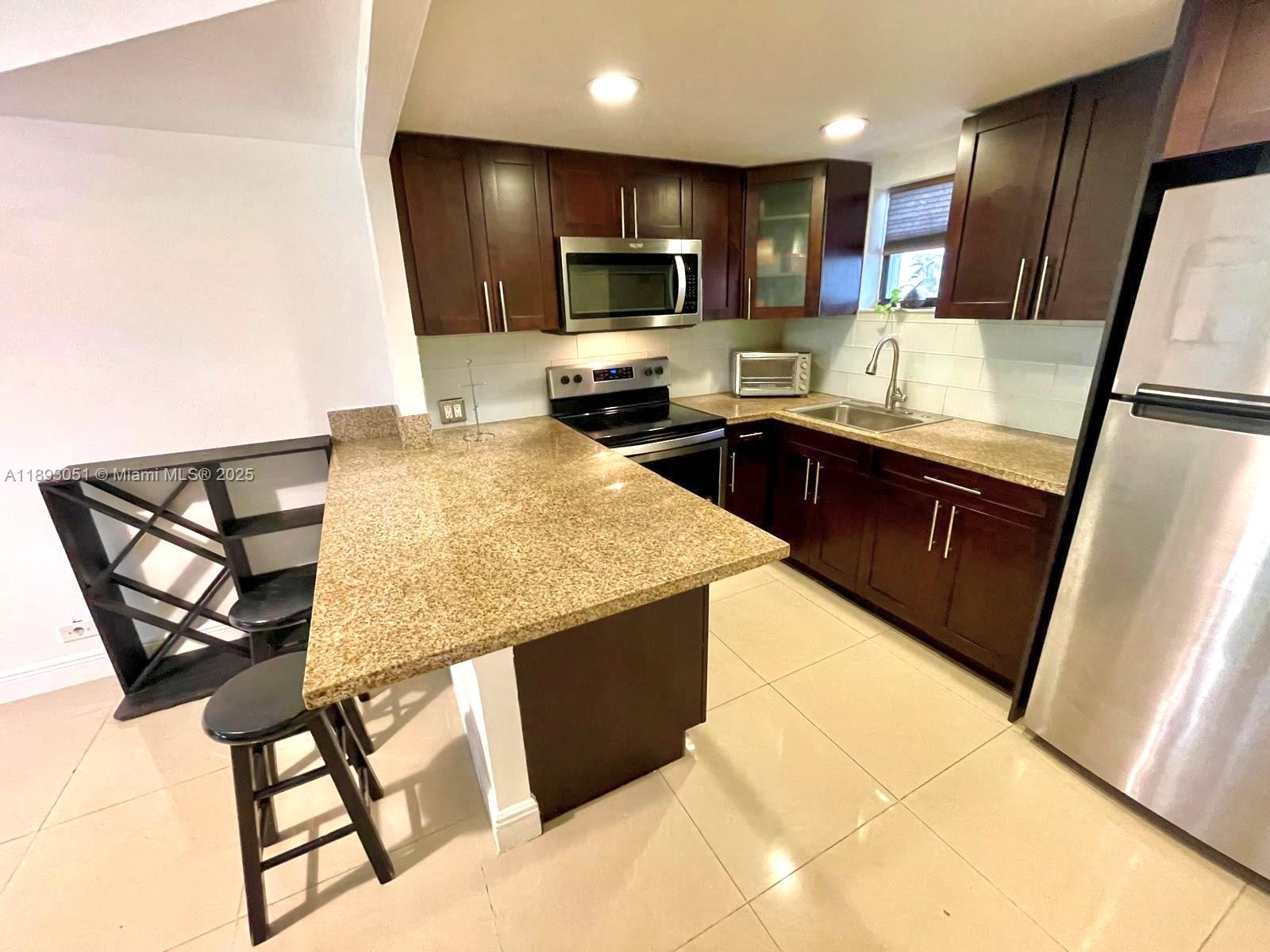 GROUND FLOOR, REMODELED 1 BED/1BATH. Spacious apt. located near the association's mailboxes and gym. Community's pool in view. NO CARPET; easy to keep! Washer and dryer in the unit, in their own closet. No dishwasher or garbage disposal. Walk-in closet in the bedroom with an additional storage on the hallway. Owner prefers to rent it FURNISHED. Association allows up to 3 adults, each adult is allowed a non-commercial car. Community is well-maintained, with tennis and racquetball courts, children's playground, clubhouse, several pools and a gym. PETS NEGOTIABLE with non-refundable pet fee. Association approval and renter's insurance required at tenant's cost. Accordion shutters in place. Water NOT included in rent. Schedule your showing! DO NOT DISTURB OCCUPANTS.