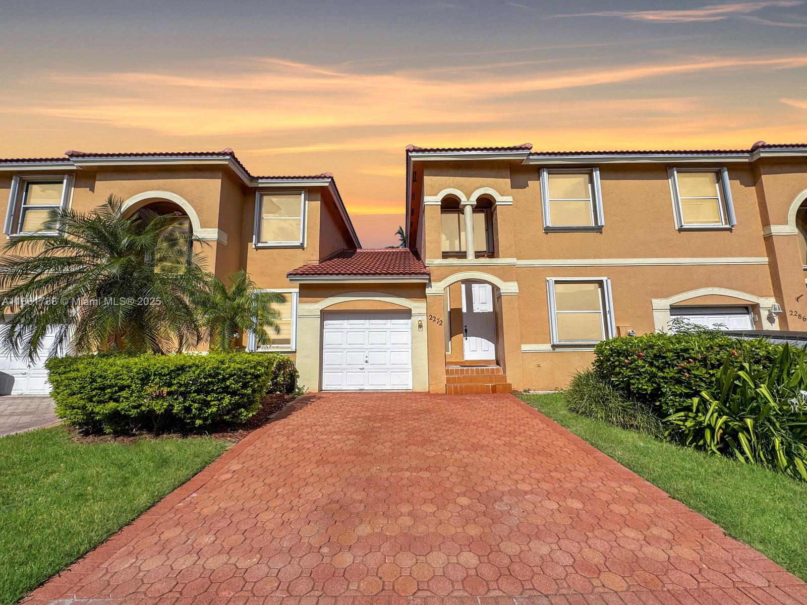 Beautiful townhouse located in the highly desirable community of Antigua, right in the heart of Pembroke Pines. This spacious 3 bedroom, 3 full bath home features an open-concept living and dining area filled with natural light, seamlessly connected to the kitchen. Step outside to a private, pavered patio, perfect for relaxing or entertaining. Enjoy the convenience of a first floor bedroom and full bathroom, along with a one-car garage and ample storage throughout. Upstairs, the primary bedroom boasts its own private balcony, offering a serene retreat. Additional highlights include a mix of impact windows and accordion shutters, a newer roof (2022), and a new A/C condenser (2024). Conveniently located close to restaurants, shopping, parks, and Pembroke Pines schools.