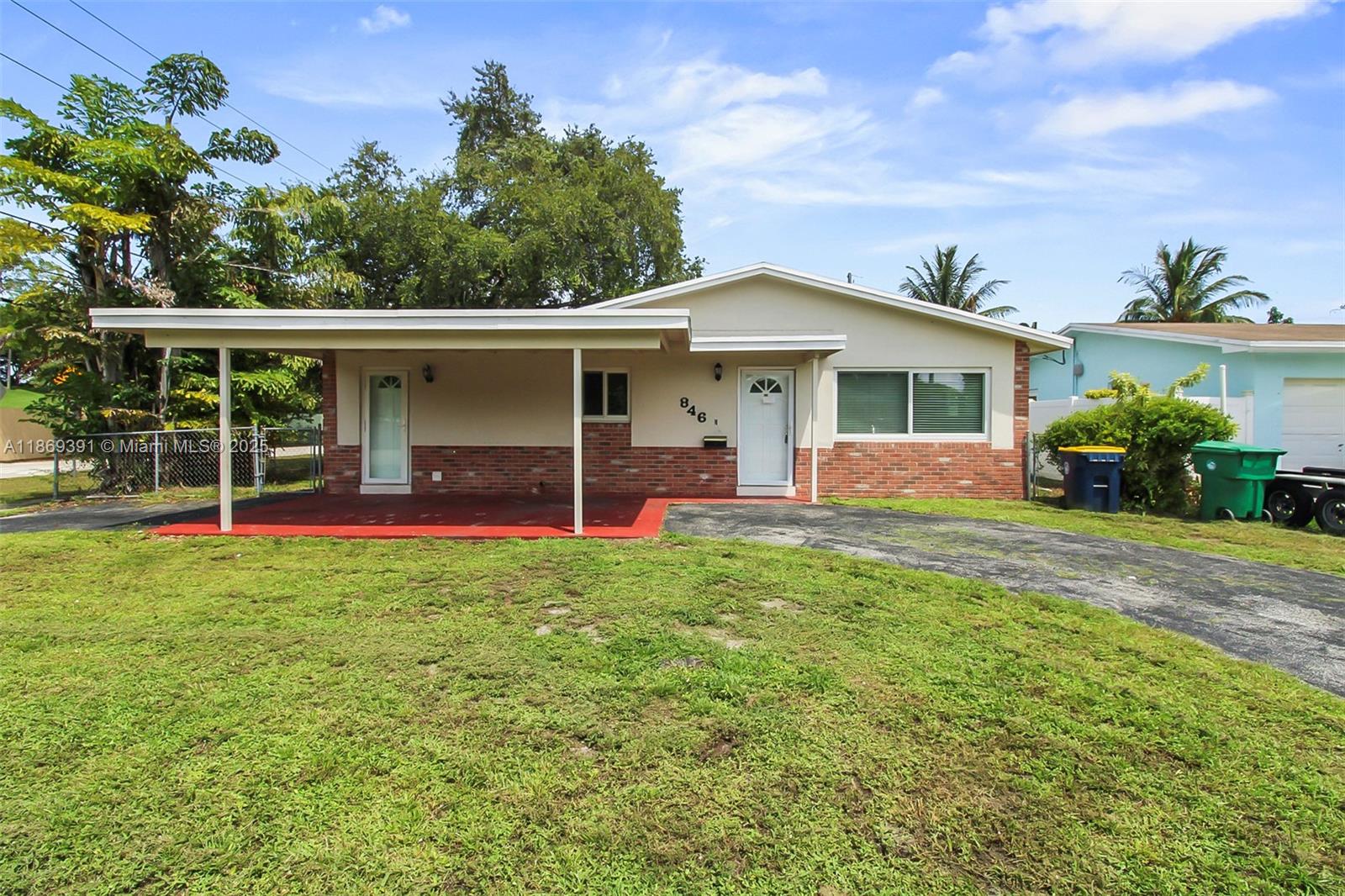 Welcome to this charming 3-bedroom, 2-bath single-family home ideally located just minutes from Fort Lauderdale Airport, & the Hard Rock Hotel & Casino. With easy access to all major highways, commuting and exploring South Florida is a breeze. Step inside to an open-concept kitchen that flows seamlessly into the living and dining areas, perfect for entertaining. The home features tile flooring throughout for easy maintenance and a clean, modern feel. Enjoy the outdoors in the spacious backyard, offering plenty of room for a pool, gatherings, or future expansion. The property also boasts a fence for privacy, a carport, and an ample driveway for multiple vehicles. Located near parks, trails, shopping, and dining, this home combines comfort, convenience, and lifestyle in one central location.