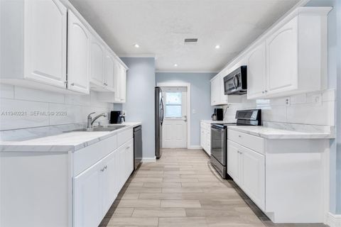 Photo of 660 NE 59th Ct, Oakland Park, FL 33334 (MLS # A11940221)