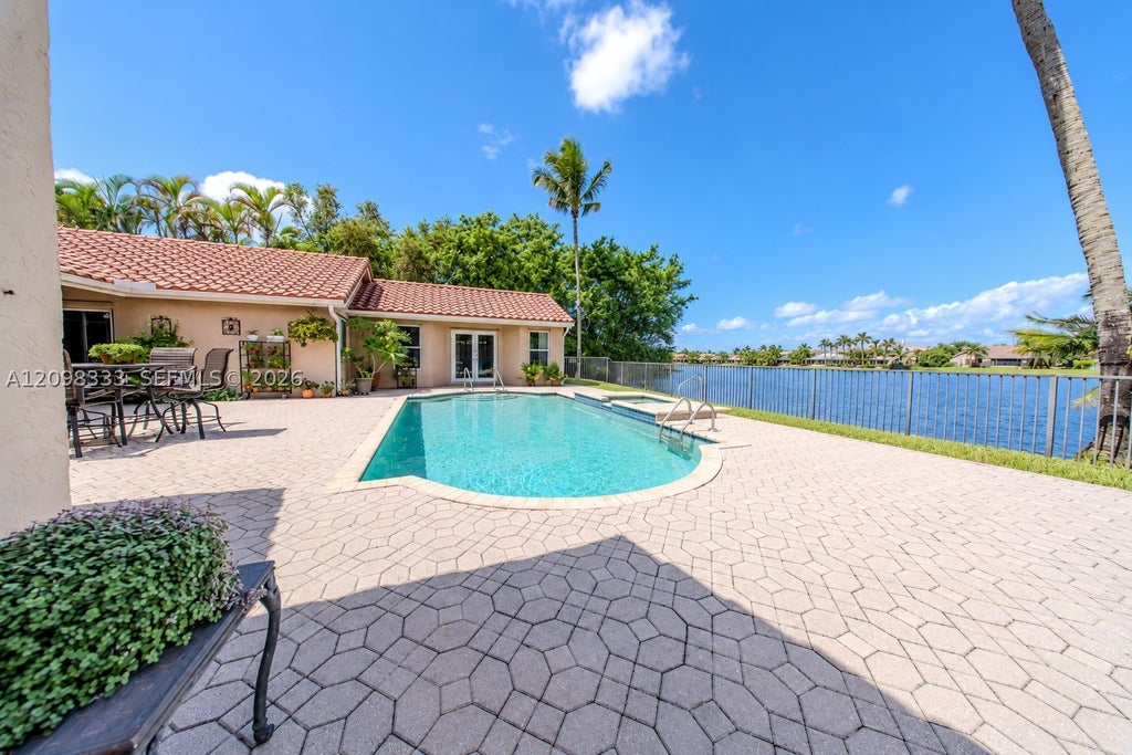 Photo of 10071 NW 7th St, Plantation, FL 33324 (MLS # A12098333)