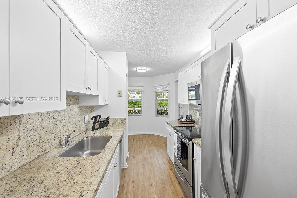 Photo of 1401 SW 128th Ter #103H, Pembroke Pines, FL 33027 (MLS # A11986685)