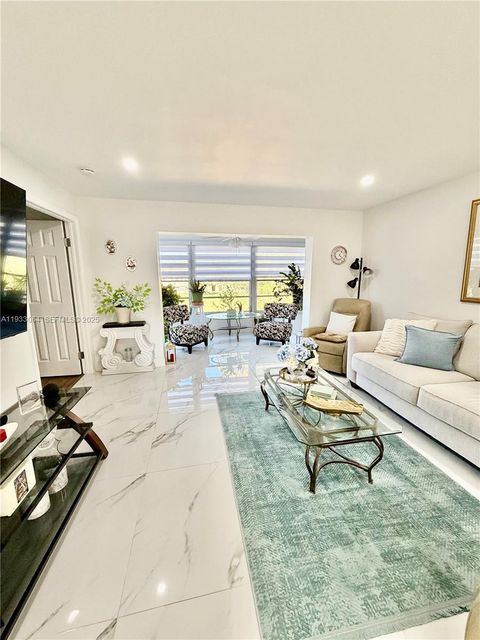 Photo of 9330 Sunrise Lakes #304, Sunrise, FL 33322 (MLS # A11933064)