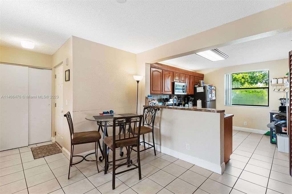 Photo of 5621 Riverside Dr #101A1, Coral Springs, FL 33067 (MLS # A11408476)