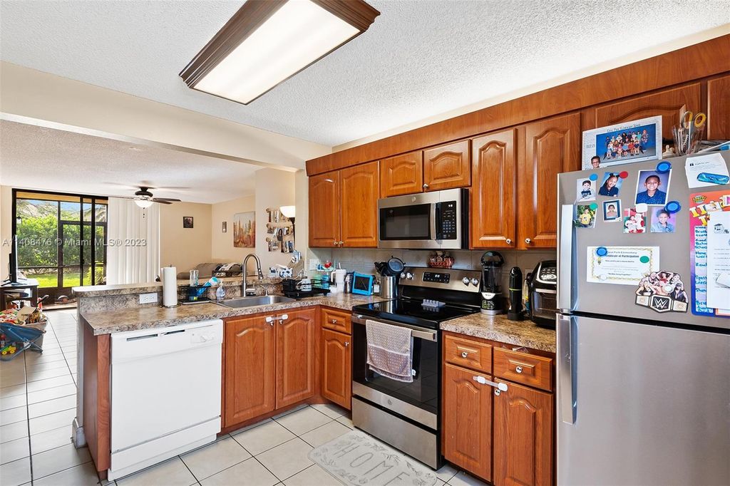 Photo of 5621 Riverside Dr #101A1, Coral Springs, FL 33067 (MLS # A11408476)