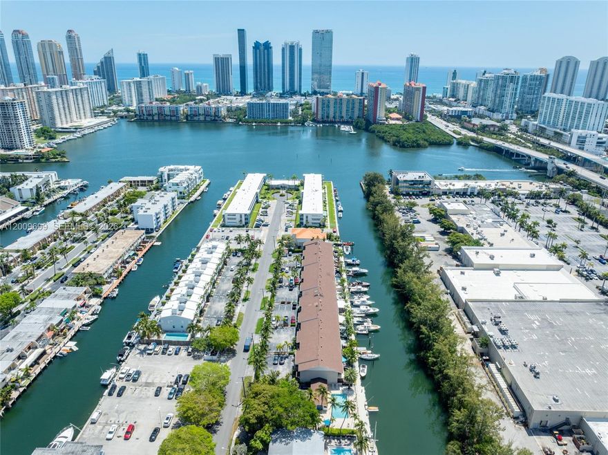 Discover the ultimate boater's paradise in one of South Florida's most exclusive enclaves. Nestled within a gated community, this stunning 3-bedroom, 2-bath residence offers rare privacy and direct ocean access with no bridges — just seconds from the Intracoastal Waterway and minutes from Haulover Inlet. Your private 35' dock sets the stage for an unmatched waterfront lifestyle. Step inside to a completely renovated, open-concept kitchen outfitted with top-of-the-line appliances, flowing seamlessly into bright, welcoming living spaces. Porcelain wood-look tile grounds the first floor while warm hardwood flooring carries through upstairs. Retreat to the expansive primary suite featuring generous walk-in closets and a spa-inspired bathroom with a soaking tub and steam shower. A new front deck, impact glass throughout, and thoughtful finishes at every turn complete the picture. With a low HOA of just $300/month, 2 dedicated parking spots, and ample guest parking, the ease of this lifestyle is unmatched. Live where others vacation.