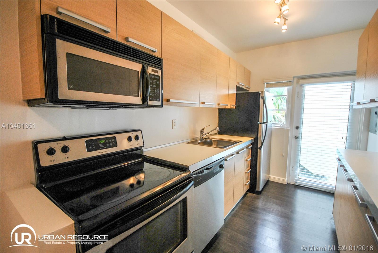 Beautifully refinished MiMo building just steps from Normandy Village & the beach with gated entrance and rear common patio. This top front corner unit features impact-resist windows, modern Italian kitchen, central A/C, SS appliances including dishwasher and microwave, new bath, and individual washer/dryer inside unit. Move right in & enjoy bright spacious living area from this tranquil corner unit w/separate dining area and great closet space. Pet friendly and fast approval process.