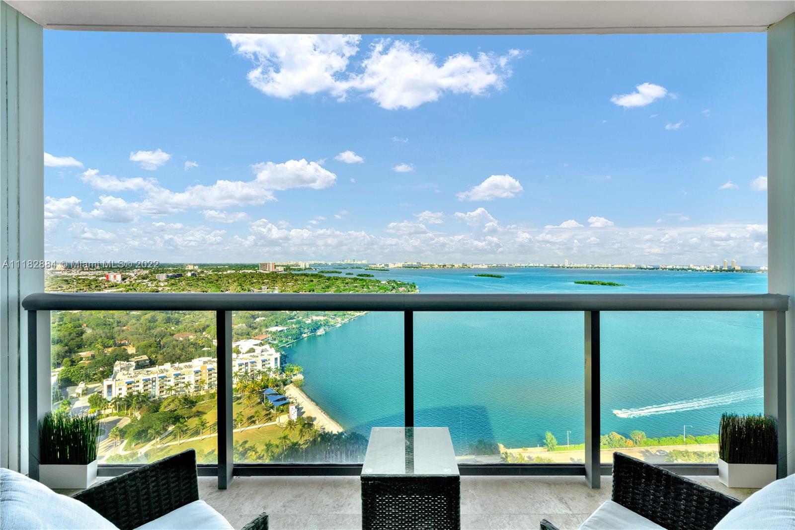 Luxurious 2bed/2.5ba unit w/ breathtaking, unobstructed Bay views! Beautifully remodeled w/ tasteful, high-end finishes in one of the highly sought-after lines in the building! Features floor-to-ceiling windows, s/s appliances, marble floors, California closets, motorized shades/blackouts, additional large storage unit, 2 adjacent parking spaces. Premier location minutes away from Design District, Midtown, Wynwood, Miami Beach, Brickell, & MIA airport. Resort-style amenities include 2 heated pools, hot tubs, sauna, movie theater, huge gym, cycling room, kids play area, game room, party room, business center, BBQ, convenience store, concierge, valet parking. Semi-private elevator foyer. Walking distance to shopping & entertainment! Furniture negotiable.