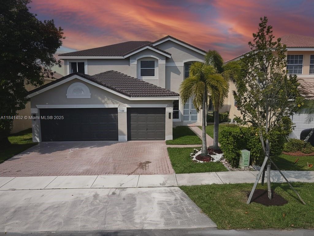 Discover the elegance of South Florida living with this exceptional designer’s home. This luxurious, ultramodern residence, located in a gated lakeside community, offers an open-concept layout and a truly unique design. Captured in stunning photos, the home exudes sophistication and is worthy of a high-end design magazine cover. Featuring numerous upgrades, including high-grade laminate finishes on the doors, this five-bedroom, three-bath property also includes a spacious family room. The expansive sliding glass doors along the back wall provide breathtaking views of the tranquil backyard and lake. Dimensions and details are sourced from government records and should be independently verified. Experience the meticulous craftsmanship and unparalleled style this home has to offer.