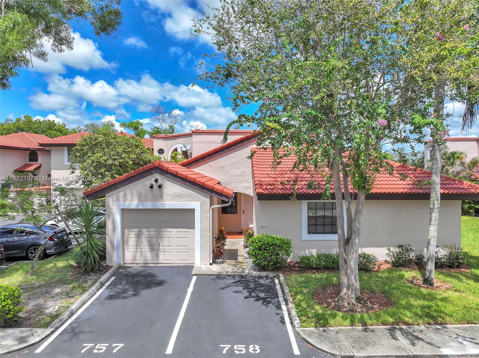 Welcome home! this well maintained 3 bed/2 bath villa offers both comfort and style in a highly desirable community, centrally located in Sawgrass Mills Mall, Plantation Walk, Highways and many restaurants and Supermarkets. This home features a split floorplan with vaulted ceilings, a spacious living/dining area which flows into the kitchen and a separate laundry room with smart appliances. Enjoy and oversized one-car garage plus two additional parking spaces along with an enclosed back patio, perfect for relaxing or entertaining. Smart home features includes a ring doorbell, yale smart lock and ecobee thermostat. The community offers amenities including a pool, clubhouse, basketball court and playground all with one of the lowest HOAs in Plantation!
