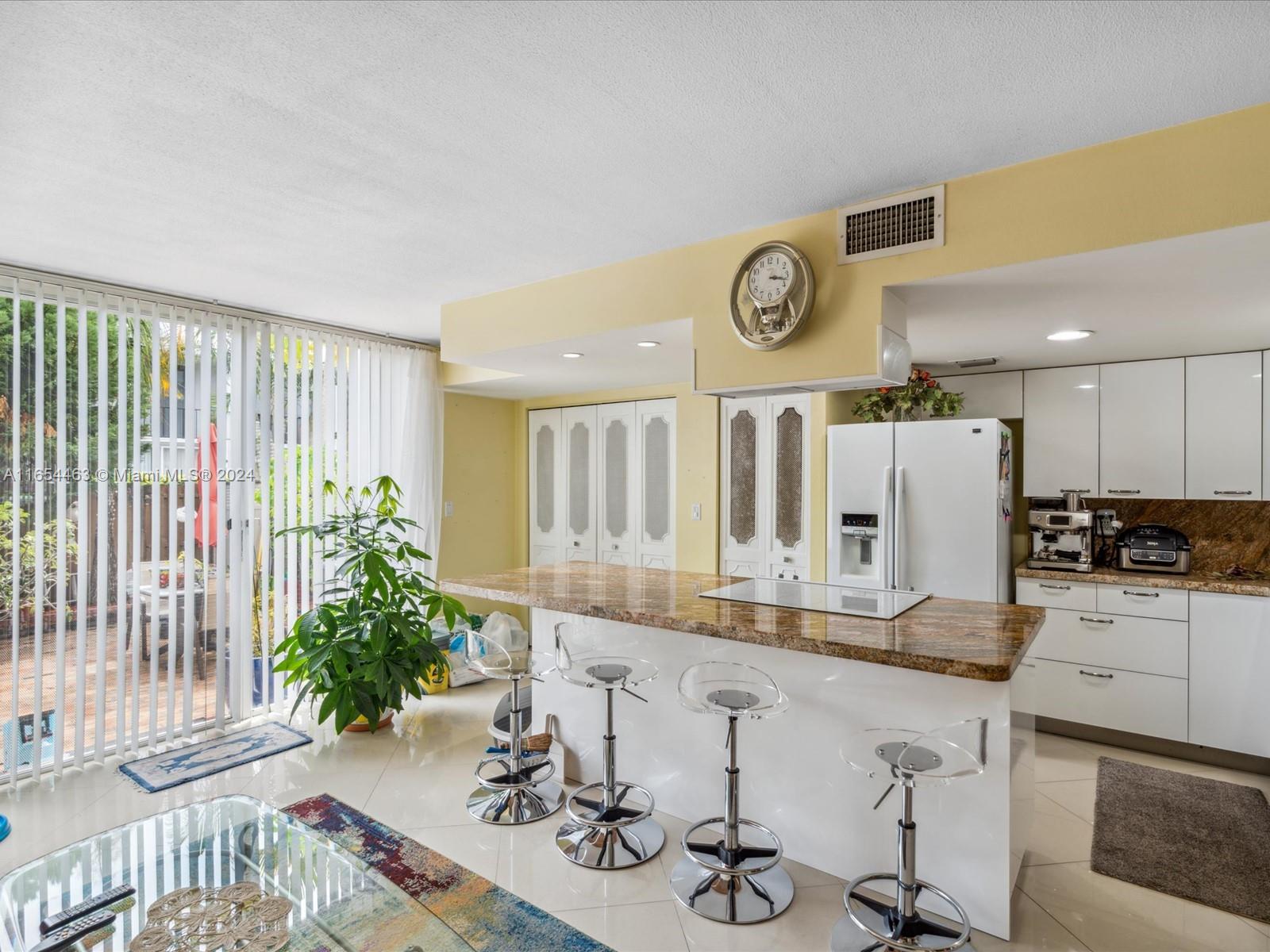 Beautifully designed and spacious bi-level townhome in Venetian Park! Rent from day one! Exquisite kitchen with a large combo dining/living area that opens to your own private courtyard. Large size washer and dryer, new AC. The front living and dining area has an open layout and 1/2 bath. Upstairs the two well-appointed master bedrooms each feature an en-suite bathroom and closets galore including huge walk-in closets! One bedroom also has a nice balcony for your morning coffee. Bedrooms are also very spacious and easily accommodate king size beds. Lovely community one half block to the water, features a common clubhouse, gym, tennis courts and pool. Location, location.. Bike or walk to the beach! Close to all everyday shopping, dining, casinos, Aventura Mall, airport, transportation.