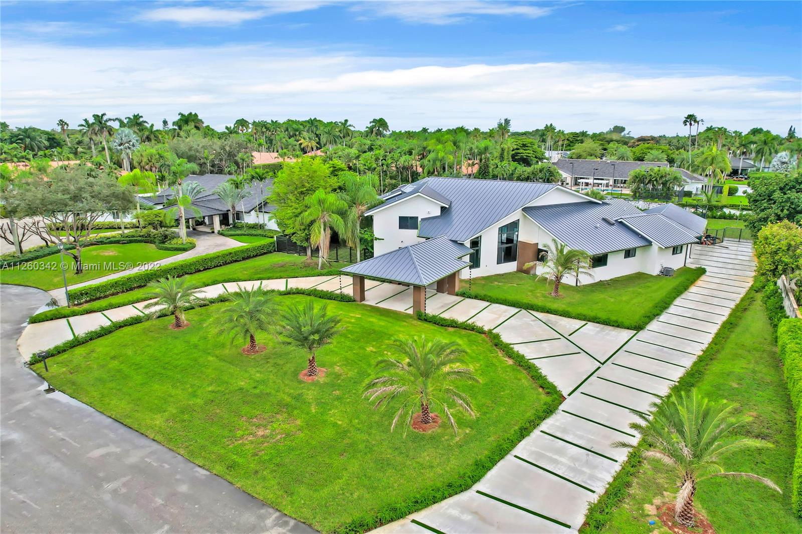 Completely Renovated Custom Luxury Acre Estate in the prestigious Galloway Glen Neighborhood. The Stunning Estate features a triple split floor plan with 6 bedrooms 5 bathrooms, Swimming pool, Tennis Court, Basketball Court, Spa, 3 car garage, new driveway with a porte-cochere. The custom walnut wood features surrounding this home is a spectacular addition to the modern contemporary finishes which include 48x48 European tiles, aluminum rails, LED lighting, A Chef's Kitchen with JenAir Built in Appliances, and a Custom built BBQ grill. Luxurious Master bedroom suite with balconies over looking the pool, private bar, custom walk-in-closets, and an amazing master bathroom with sauna. New Metal Roof with Impact Glass doors and windows. 6,832 SQFT of GLA 40,075 SQFT LOT! Priced @ $585 per ft