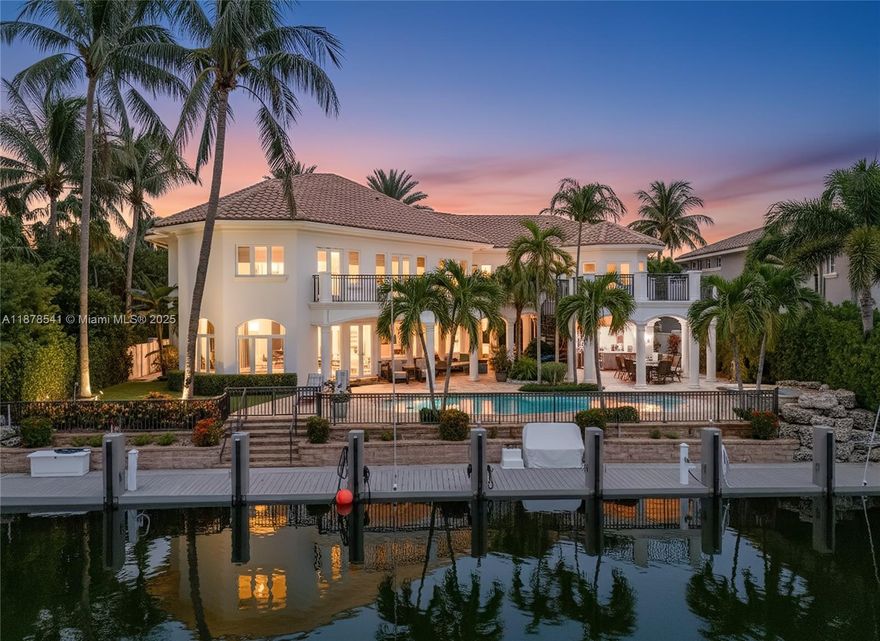 A Mediterranean-inspired masterpiece, this waterfront estate marries timeless architectural grandeur with modern sophistication along 98 feet of deep-water frontage. The grand foyer with soaring ceilings opens to a sunlit great room framed by sweeping water views. The chef’s kitchen, newly updated with oversized island and professional gas range, is a true centerpiece. Two primary suites—upstairs and down—offer spa-inspired marble baths, one with cold plunge, & custom walk-in closets. Additional highlights include a mahogany office, three ice makers, dishwashers upstairs and down, an entertainment lounge with wet bar, sauna, heated saltwater pool, and new dock. A Crestron smart home system, dual laundry rooms, back staircase, full house generator, and 3-car garage complete this residence.