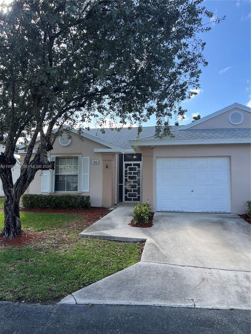 This 2 bedroom, 2 bathroom home has a new roof (2018), a new A/C (NEST 2022), a new disposal (2018),new auto door opener for garage door (2019), and new pipes (2018). The home features sliding doors, wood floors, crown molding, walk-in closets, granite counter tops, accordion shudders, and a tiled patio.