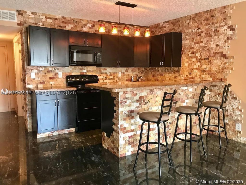 Photo of 600 SE Three Islands Blvd #1018, Hallandale Beach, FL 33009 (MLS # A12048245)