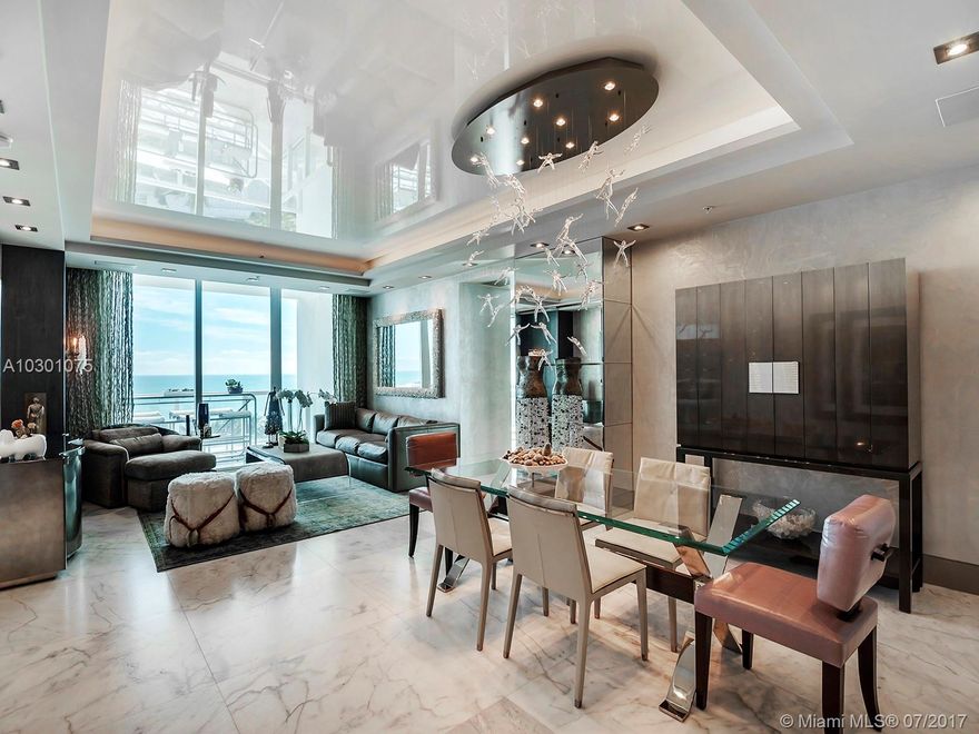 Contemporary oceanfront masterpiece with elegant decor by Christopher Raessler of RGR Design Associates. 1977 sq.ft. of impeccable living space plus spacious balcony with direct ocean view. Private foyer entrance, crystal oyster antique marble floor, Boffi & Donbracht baths, custom cabinetry with TV lift, AV system, custom drapery with motorized solar shades. Continuum offers 12 acres of luxury living with pool & beach service, gym & spa, 3 tennis courts, restaurant, concierge, valet parking & security.