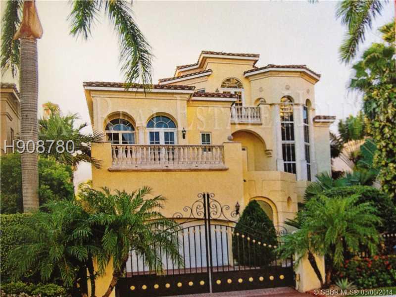 LIVE on exclusive and guard-gated ISLAND ESTATES. This home HAS 110 OA LINEAL FEET DOCK!! Intercostal views from the front and the back of this gorgeous 5,745 sf Mediterranean home. DOCK YOUR YACHT across your home! Beautiful marble floors and stunning m arble staircase Features 5 bedrooms 6 full baths and 1 half bathroom. Opulent Master suite, workout room, elevator, Impact glass. IDEAL for a LARGE VESSEL OWNER!