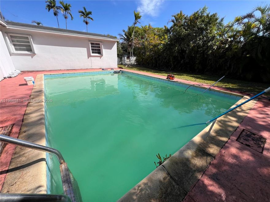 Prime location with exceptional potential to renovate and customize to your personal taste, an ideal opportunity to create your dream home. Enjoy a spacious backyard featuring a pool, perfect for summer entertaining and outdoor living. The expansive lot offers ample room to design a children's playground or build a BBQ cabana. Plenty of space to accommodate your RV, boat or both. Enjoy the Avocado, Mango and Zapote’s trees.
NO ASSOCIATION, plenty of gated parking available for your family. **ROOF AND AC 2020**. Endless possibilities await just for you ! NO BACK NEIGHBORS.