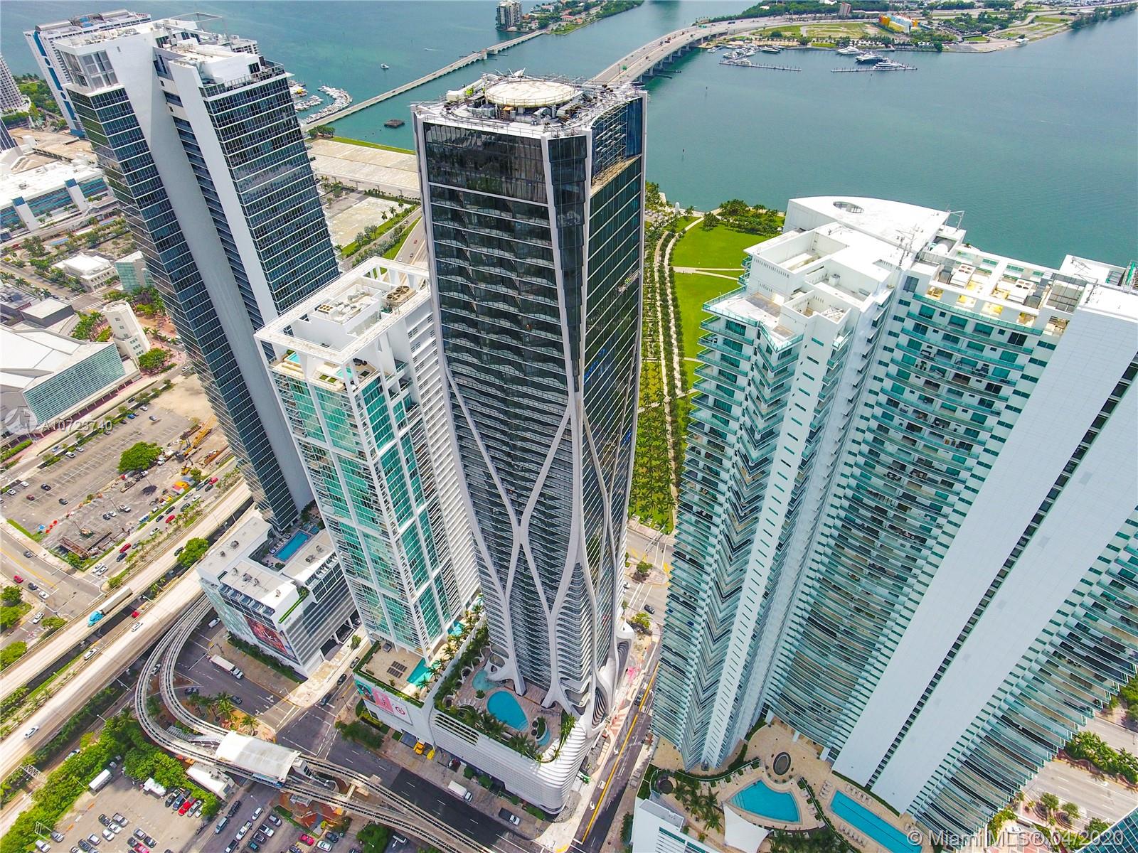 Luxury building One Thousand Museum by Zaha Hadid, Miami's most prestigious new residential tower, blurs the lines between art and architecture. This limited collection of museum-quality homes offers an unprecedented level of service and amenities. This impeccable residence on 22 floor 4 bedrooms/ 5.5 bathrooms/ family room / maid quarters has been custom designed with only the finest finishes with custom closets and marble flooring. Amenities Roof top Helipad, Beach Club, 1KM Spa, Gym Technogym , Juice Bar by Raw Republic , Culinary chef Mame Saw, Concierge, Private Limo Service , Deposit Safe Room