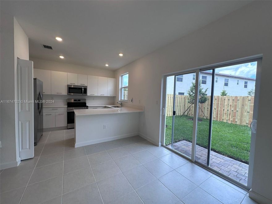 Stunning New Construction! This modern home features 3 bedrooms and 2.5 bathrooms, including a spacious family room, all set on a premium lake-view lot. Located in a prime area, just a short walk from Miami Dade College North Campus, and close to Miami International Airport, Downtown Miami, Aventura Hospital, Doral, shopping, dining, parks, and entertainment. Enjoy easy access to I-95 and the Turnpike. This vibrant community offers lush landscaping, with upcoming amenities including a swimming pool, hot tub, fitness center with state-of-the-art equipment, a clubhouse, and a tot lot. Gated entrance and 24/7 security are also coming soon. For additional details, please refer to the broker's remarks.