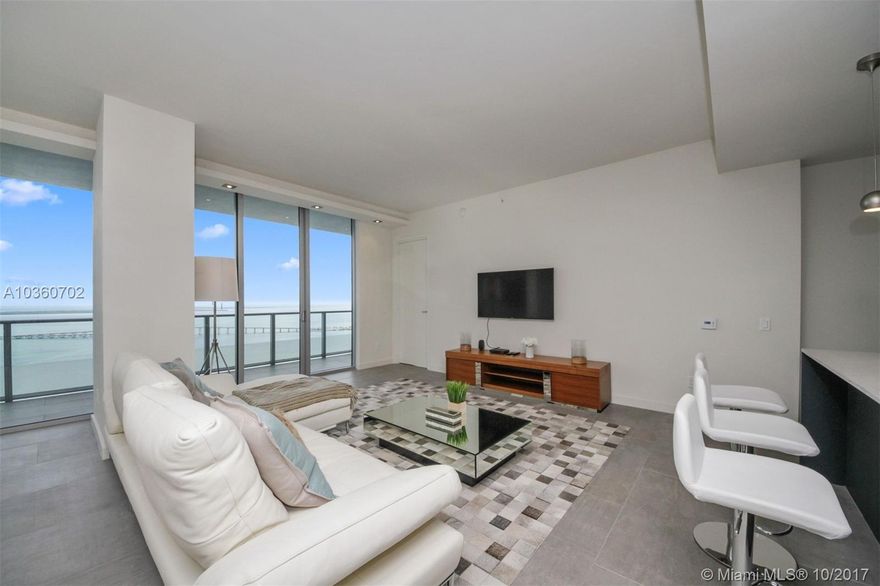 Breathtaking bay and ocean view from the 41st floor at Brickell House. This 1,622sqft, 2 Bedrooms and Den (converted into 3rd bedroom) 3 Bathrooms comes fully furnished.  Open kitchen with stainless steel appliances. Italian porcelain floor, custom made closets. The unit comes with 2 valet parking. Amenities include a 50 foot long lap pool, fitness center, resident club room with conference room, family room, movie theather and much more... The building is located few minutes away to restaurants, shopping mall at Brickell City Centre, close to the I-95 that will take you quickly to South Beach and the airport.