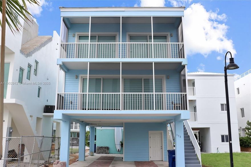 Immerse yourself in this seaside retreat in the heart of the Florida Keys.  With its recent construction, this FURNISHED home blends modern-day finishes and is withing walking distance of the community dock. The galley chef’s kitchen makes gatherings simple and memorable, ideal master bedroom on the ground floor, while the entertaining area is upstairs.  The balcony from the living room opens to breathtaking ocean views, and has more outdoor spaces from the guest rooms above.  This exclusive resort offers an infinity pool, fitness center, tennis and basketball courts, children’s play area, boardwalk pier, and an enchanting beach—where the ocean truly becomes your neighbor.  Available for annual rent or seasonal rent (October - May)