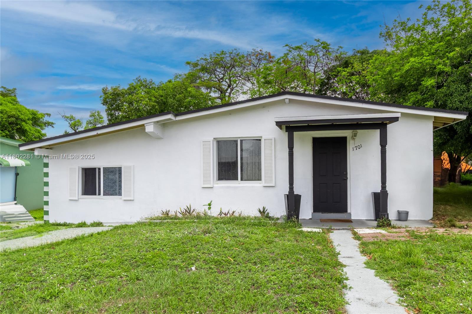 Beautiful 4BD/2BA home on a 7,682 SF lot with solar panels, EV charger, and impact windows for energy efficiency and peace of mind. Porcelain tile floors and wood ceiling beams add charm to the bright living spaces. One bedroom has a private entrance—perfect for guests or rental income. Enjoy outdoor living in the spacious, shaded backyard. No HOA means freedom to park RVs, boats, or trucks. Prime location near Las Olas, Downtown Ft. Lauderdale, I-95, and US-1. Just 10 minutes to the beach or airport. Come see this move-in-ready, eco-friendly gem! Seller offering $5k towards buyer's closing costs.