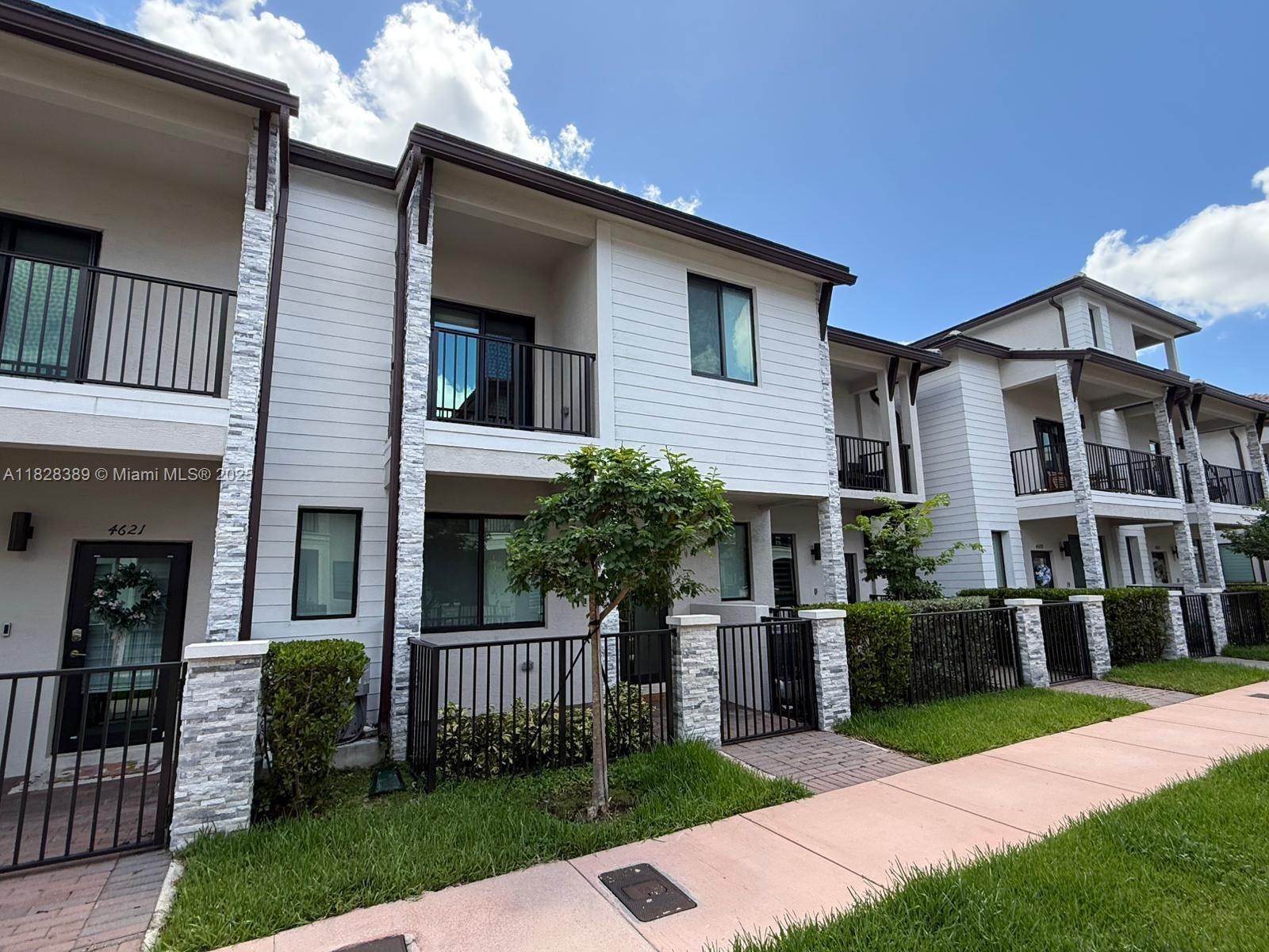 Beautiful 4-bedroom, 2.5-bath home with a 2-car garage located in the heart of Downtown Doral. Built in 2022, this modern residence features an electric vehicle charger, luxurious marble flooring on the first level, stylish tiled accent walls, and hurricane-impact windows and doors for enhanced safety and comfort. All bedrooms and the laundry room are conveniently located upstairs, offering privacy and practicality for everyday living. Enjoy walkable access to renowned restaurants, supermarkets, shops, and pedestrian-friendly green spaces. Ideal for families, the home is within the boundary of top-rated A+ charter schools, with the elementary school just a few blocks away (less than a 10-minute walk) and the middle school under 5 minutes by car.