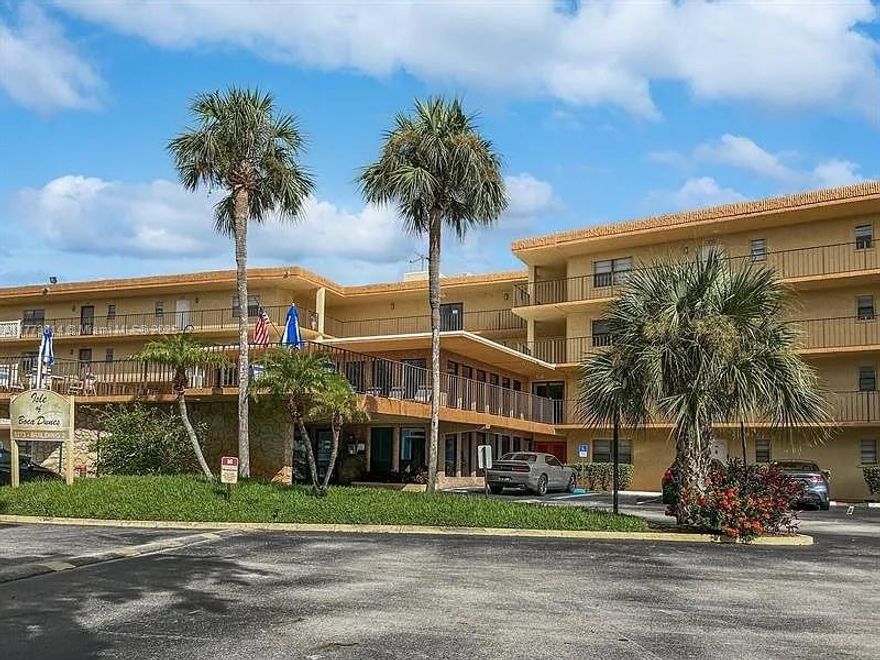 This spacious 2-bedroom, 2-bathroom unit is located in the desirable Isle of Sandalfoot community. Situated on the 3rd floor, this unit offers serene views from your private screened balcony, perfect for enjoying Florida's sunny weather. The interior features an open-concept living and dining area with abundant natural light and plenty of storage. Granite countertop in the kitchen and SS appliances. Full-size washer and dryer inside the unit. Both bedrooms are generously sized, with 2 walk-in closet in the primary bedroom. One assigned parking spot and plenty of guest parking. This well-maintained community offers golf courses view, a pool and cabana area. Conveniently located near shopping, dining, parks, A-rated schools.