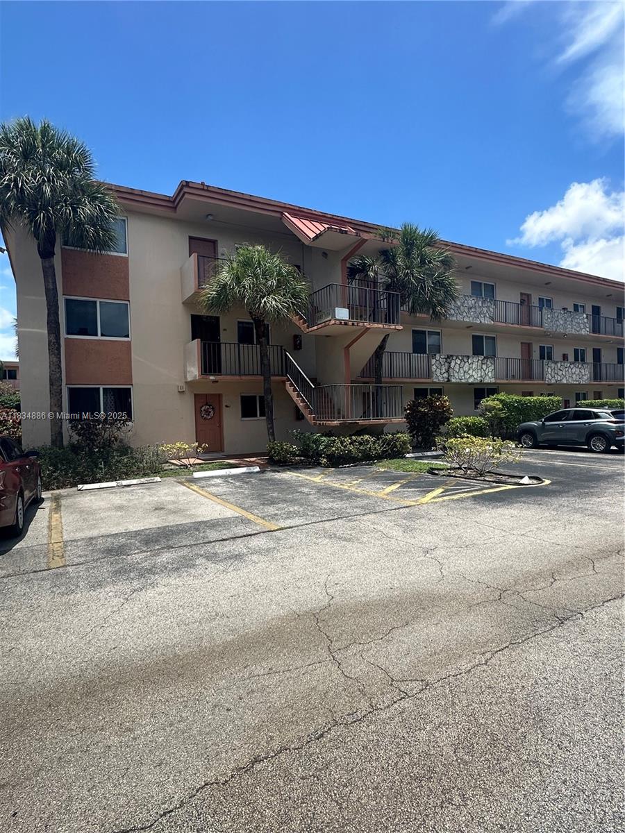 Spacious 2-bedroom, 2-bath corner unit in the heart of Sunrise, located in the desirable 55+ community of Water Bridge. This bright and airy condo offers plenty of natural light, a comfortable layout, and assigned parking directly in front of the unit for added convenience. Laundry and extra storage are located on the same floor, making daily living even more convenient. While the unit could use some updating, it presents the perfect opportunity to bring your personal touch and make it your own. Community amenities include a clubhouse, pool, and more. Centrally located near shopping, dining, and major highways. Priced to sell—don’t miss out!