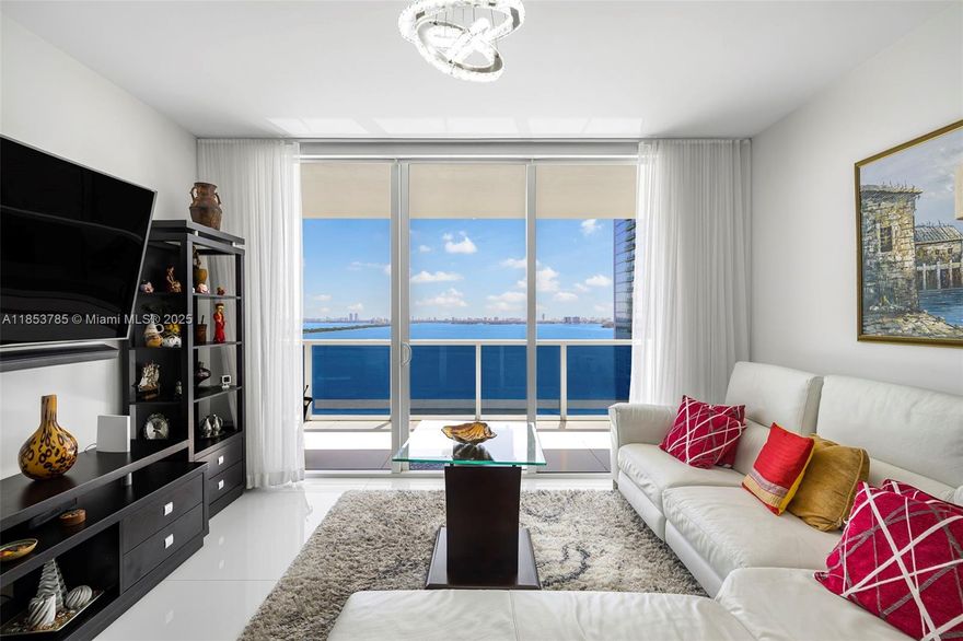 Discover luxury living in this 3-bed, 3-bath condo on the 26th floor of Bay House Miami. Enjoy sweeping panoramic views of Biscayne Bay and Miami Beach from the expansive balcony, with natural light pouring in through floor-to-ceiling impact windows and tile flooring throughout. The split floor plan ensures privacy, with each bedroom featuring built-in cabinetry for added storage. The Italian kitchen is equipped with quartz countertops and premium stainless steel appliances. Resort-style amenities include a heated pool, spa, gym, yoga studio, business lounge, and more. This unit includes two assigned parking spaces and private storage. Located in vibrant Edgewater, just minutes from Wynwood, the Design District, and Downtown Miami, this highrise offers the ultimate Miami lifestyle.