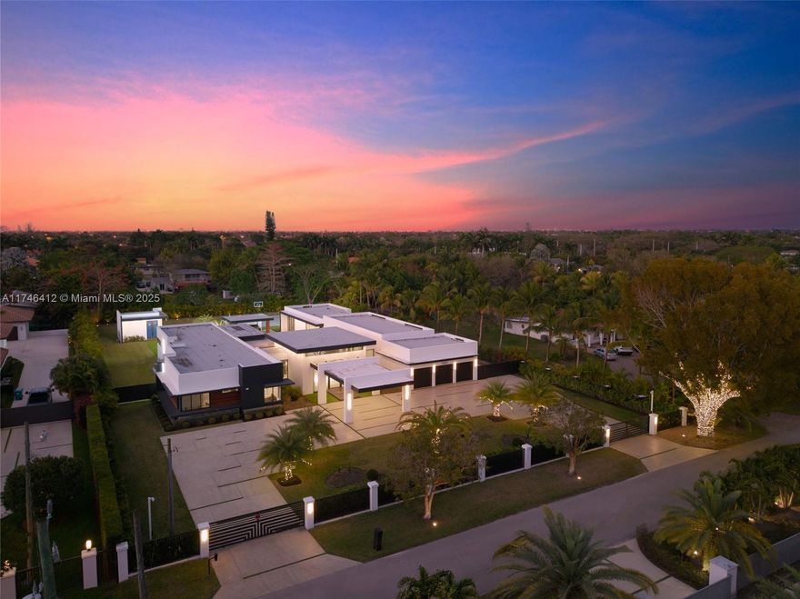 This 7-bed, 6.5-bath estate epitomizes sophistication & craftsmanship. A grand foyer with 17-ft ceilings & Italian porcelain tile greets you. The home features 12-ft & 10.5-ft walls, impact-resistant doors, & high-end sliding doors blending indoor/outdoor spaces. The master suite boasts custom Italian closets, a smart toilet, & infinity bathtub. A "mini-master" suite has its own smart toilet. Five Toto toilets & a Jack-and-Jill bath serve other bedrooms. A 400-sqft gym, gourmet kitchen with Fisher & Paykel appliances, Bosch exterior kitchen, outdoor pool, Jacuzzi, gazebo, half basketball court, putting green, & pool house complete the estate. With surround sound, gas-powered systems, state-of-the-art home security, & 1,000-gallon underground gas tank, no detail is spared.