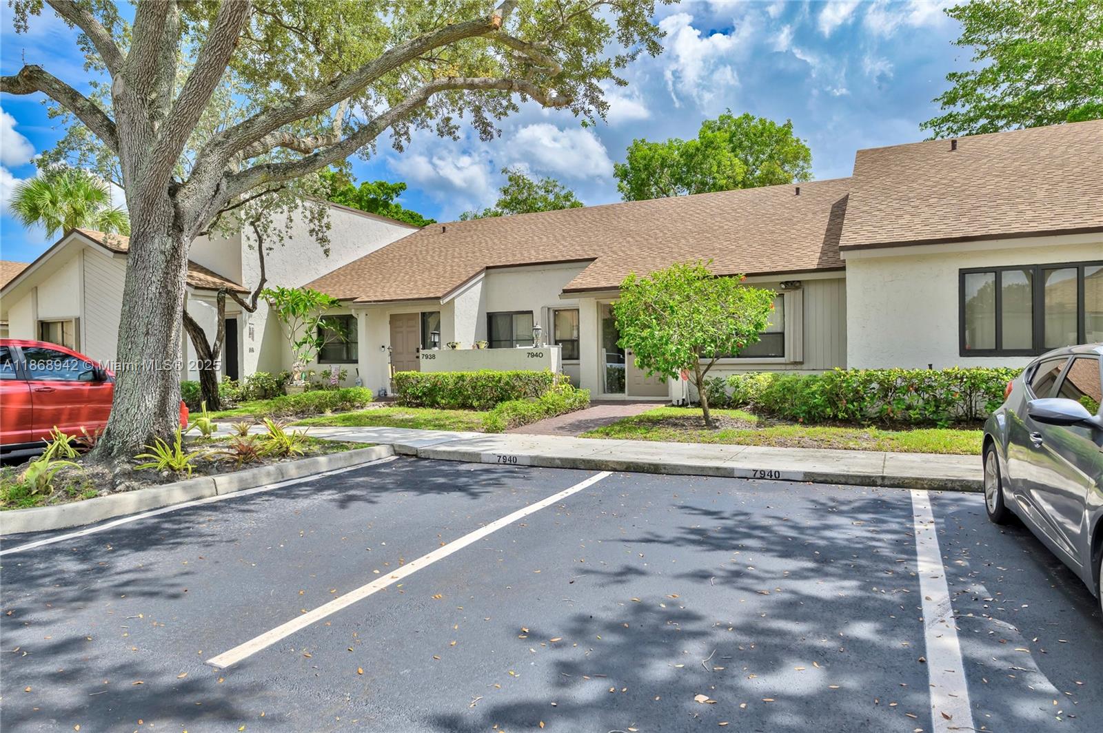 Fully remodeled waterfront townhome located in Alpines Woods of Jacaranda. This one-story 2 Bed / 2 Bath townhome features high vaulted ceilings with new recessed lighting throughout, all new floors with modern baseboards, new custom bathrooms, plus a new eat-in kitchen complete with SS appliances and quartz countertops. This villa offers a large primary suite with dual sinks and a walk-in closet. The townhome is protected with high-impact accordion shutters and a private covered terrace with a laundry closet and new water heater. Two private parking spaces, New roof and Low HOA with lawn care included!