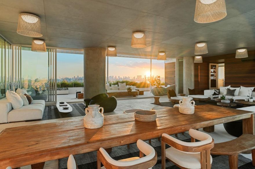 SkyHouse, the crown jewel of The Ritz-Carlton Residences Miami Beach, rises above the water with 300°+ unobstructed views and nearly 9,000 SFt of refined indoor/outdoor living. A newly enclosed modular great room transforms the former open terrace into an all-season sanctuary, with glass walls that glide open to welcome the ocean breeze or close for a serene private retreat. Floor-to-ceiling windows and wraparound terraces frame Miami’s most dramatic sunrise, sunset, ocean, bay, and skyline vistas. Designed by award-winning CEU Studio, the residence reflects a Bali-inspired tropical modern aesthetic. Custom Balinese furnishings, including heirloom pieces carved from reclaimed old-growth wood, bring warmth and soulful character. Natural textures, sculptural forms, and a calm organic palette define its effortless luxury. The primary suite features a Salvatori Signature bathroom overlooking the bay, custom Porro closets, and Fantini fixtures, while the Boffi kitchen w/ Gaggenau appliances delivers Italian precision. SkyHouse is the only residence w/ a dedicated butler, offering unmatched personalized hospitality. Additional private features include a 40 boat slip, an enclosed 2-car garage, and reserved parking exclusive to SkyHouse. Residents also enjoy Ritz-Carlton amenities, including a poolside restaurant, theater, spa, and state-of-the-art fitness center. More than a home, SkyHouse is a private resort in the sky where tropical modern design and world-class service converge.