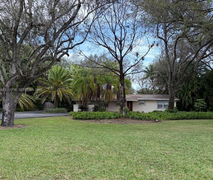 Set on an expansive 1.25-acre, this residence perfectly balances luxury and serenity. Featuring a generously sized kitchen that is equipped with a gas cooktop, stainless steel appliances, and abundant counter space, this home is ideal for both everyday living and entertaining. Elegant French doors lead into a bright and airy living area which offers an abundance of natural light. Step outside to your personal oasis, where a screened-in pool and heated jacuzzi provide the perfect setting to relax and unwind in complete privacy. Lush, mature landscaping surrounds the property, offering a tranquil, secluded atmosphere. Property incudes a detached 4-car garage, complete with an attached 1 bedroom apartment. Ideally located, this home offers convenient access to top-rated schools, premier shopping, dining, and major highways.