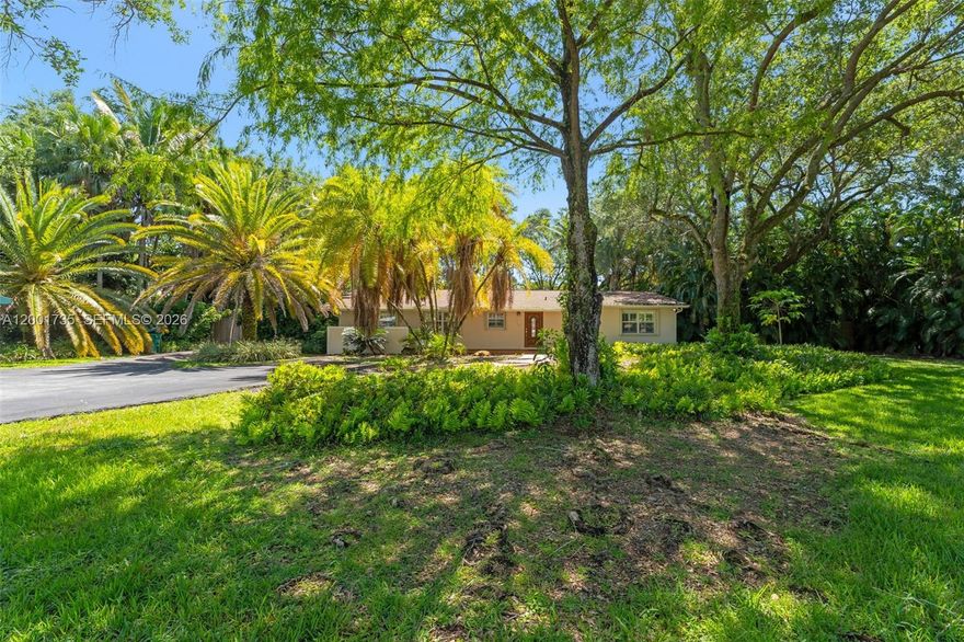 Set on an expansive 1.25-acre, this residence perfectly balances luxury and serenity. Featuring a generously sized kitchen that is equipped with a gas cooktop, stainless steel appliances, and abundant counter space, this home is ideal for both everyday living and entertaining. Elegant French doors lead into a bright and airy living area which offers an abundance of natural light. Step outside to your personal oasis, where a screened-in pool and heated jacuzzi provide the perfect setting to relax and unwind in complete privacy. Lush, mature landscaping surrounds the property, offering a tranquil, secluded atmosphere. Property incudes a detached 4-car garage, complete with an attached 1 bedroom apartment. Ideally located, this home offers convenient access to top-rated schools, premier shopping, dining, and major highways.