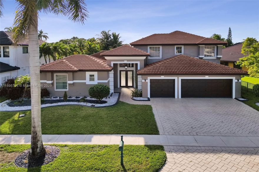 Luxury living in Sunset Lakes! This stunning 7 Bedroom / 5 Bath estate features a sparkling pool, soothing Jacuzzi, serene lake views, and a private in-law suite. Soaring ceilings and natural light flow through expansive living areas, while the gourmet kitchen boasts granite counters & stainless steel (gas) appliances. The elegant primary suite on 1st floor offers a spa-style bath & walk-in closets. Entertain with ease on the covered patio overlooking the pool, Jacuzzi, & lakefront. Perfect for multi-generational living, this home blends comfort and style in one of Miramar’s most desirable gated communities. Sunset Lakes amenities include clubhouse, resort pool, fitness center, tennis courts & more. Close to top schools, shopping, dining, and highways—this rare gem truly has it all!