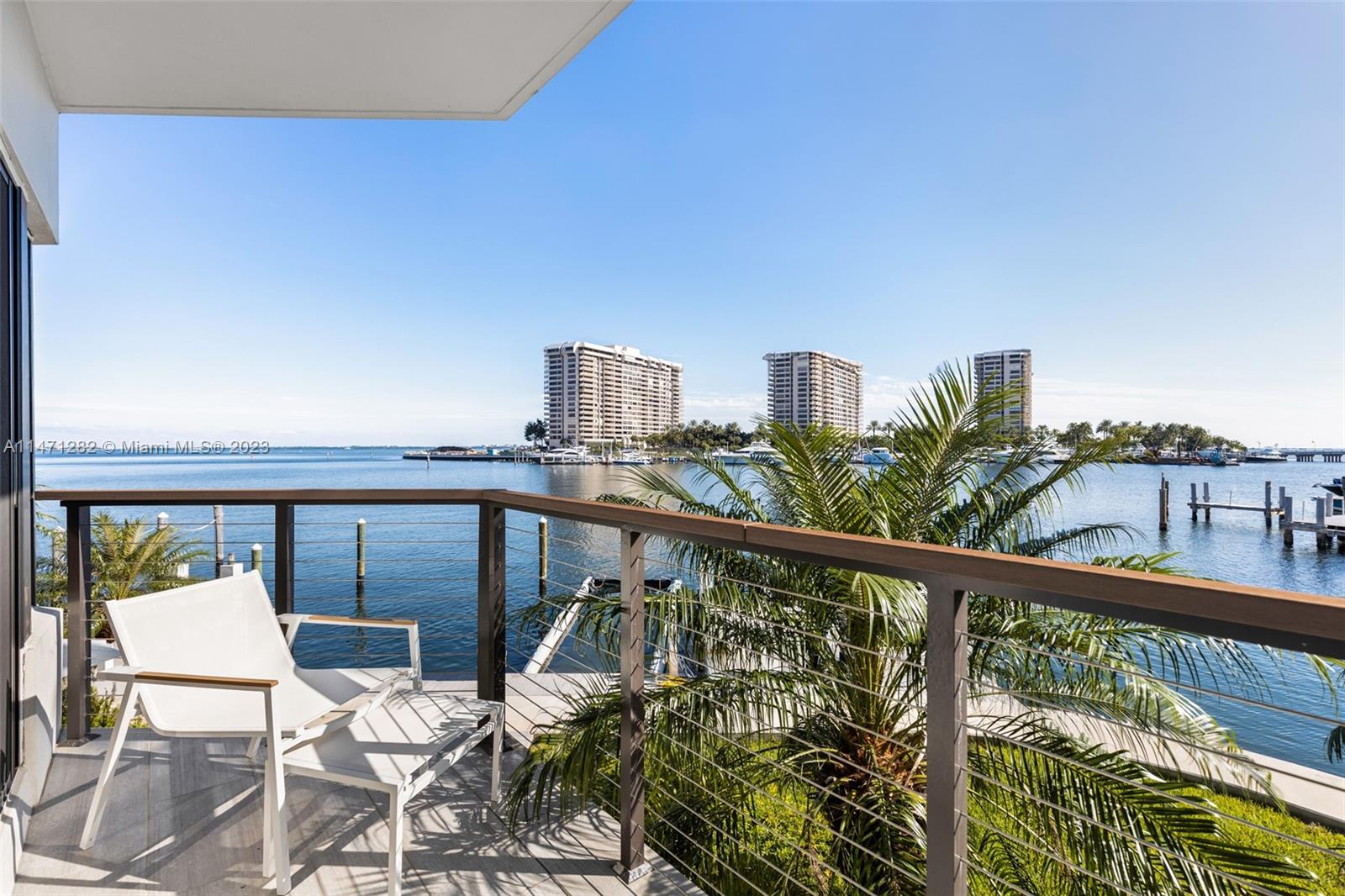 Stunning waterfront townhome in an ultra-private gated community of 8 residences. Light-filled living spaces offer spectacular bay views from each level. The unit has designer updates throughout, including a sleek, modern-style eat-in kitchen w/Bosch appliances & stone countertops. 2 BRs/3.5 BA’s + ground level flex space w/floor to ceiling glass (easily converted into 3rd BR). Captivating upper-level primary suite features wood-beamed vaulted ceilings and spa-like bath w/soaking tub & frameless glass shower. Experience idyllic outdoor living on the expansive private deck overlooking your own 40’ boat slip w/no bridges to the bay & ocean. Just minutes to downtown, Brickell, Key Biscayne and to world-class shopping & dining in the historic village of Coconut Grove.