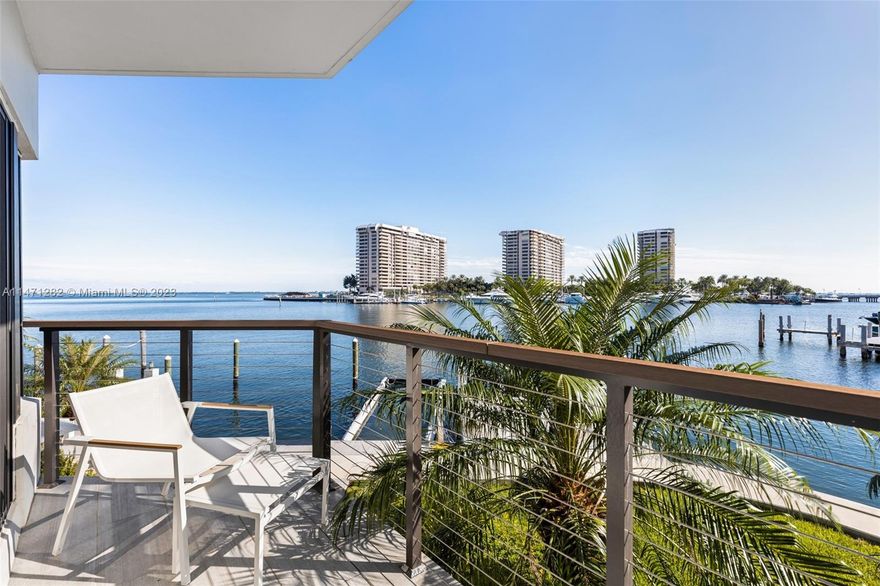 Stunning waterfront townhome in an ultra-private gated community of 8 residences. Light-filled living spaces offer spectacular bay views from each level. The unit has designer updates throughout, including a sleek, modern-style eat-in kitchen w/Bosch appliances & stone countertops. 2 BRs/3.5 BA’s + ground level flex space w/floor to ceiling glass (easily converted into 3rd BR). Captivating upper-level primary suite features wood-beamed vaulted ceilings and spa-like bath w/soaking tub & frameless glass shower.  Experience idyllic outdoor living on the expansive private deck overlooking your own 40’ boat slip w/no bridges to the bay & ocean. Just minutes to downtown, Brickell, Key Biscayne and to world-class shopping & dining in the historic village of Coconut Grove.