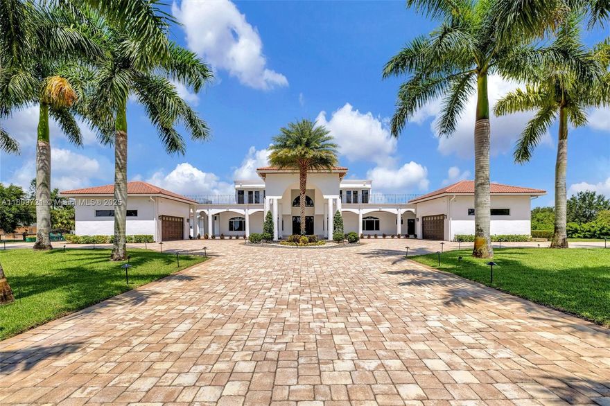 Discover this extraordinary private oasis located within Southwest Ranches. This modern estate sits on 2.5 acres and boasts 8 BEDS and 7.5 BATHS across the main residence and private guest house. Newly constructed in 2018, the residence has top of the line finishes including marble and wood flooring throughout. The gourmet kitchen is a chef’s dream and features Wolf and Sub-Zero appliances. Entertain effortlessly in the expansive and private outdoor area that includes a state-of-the-art pool, summer kitchen, and ample space for lounging and dining. The estate is secured by two private gates and includes a gorgeous porte-cochère and 6-car garage. All Impact Glass throughout. No HOA.