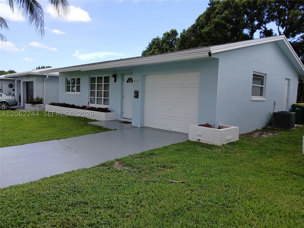 Photo of 4502 NW 46 St, Tamarac, FL 33319 (MLS # A12062244)