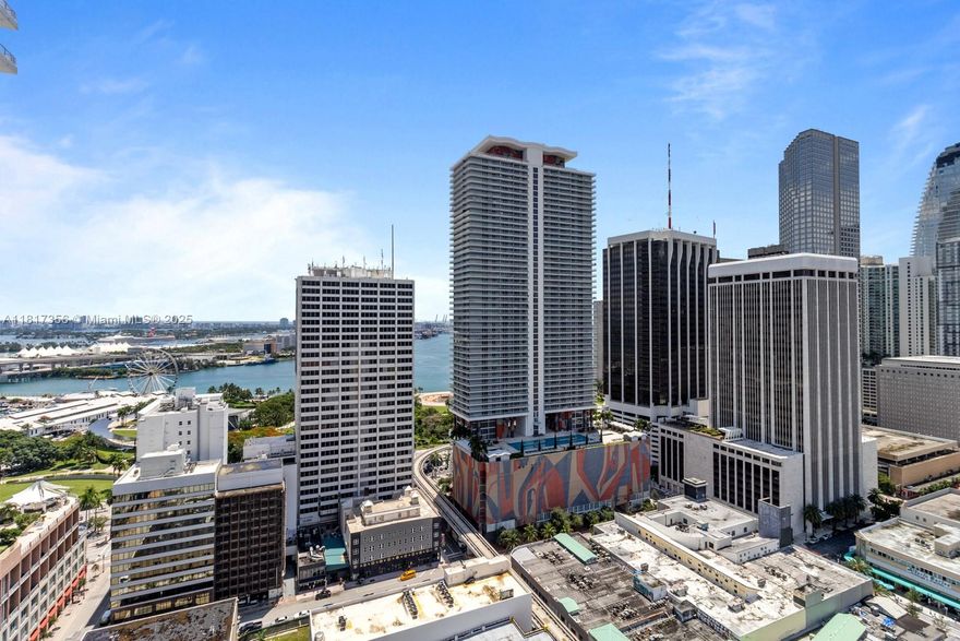 BEST PRICE! For this Exquisite residence renovated to perfection! High floor, Corner exposure with views of the bay. Floor plan consists of two private bedrooms, a living room anchored by two large sliding glass doors that enhances the home with lots of Natural Light. Once the sun goes down, the lights come on! Features include high ceilings, open kitchen, spacious baths, washer and dryer. Enjoy this completely renovated residence from kitchen to baths, all appliances and modern furnishings including a new A/C Unit! Building offers 24hrs front desk attendant, secured entry, rec room w/pool table, rooftop pool, rooftop gym w/locker room & sauna, lap pool in a serene setting, & more. Walk to the Arena, Bayside, Theaters, Museums, Brickell, & 7 miles to So Beach! COME VIEW TODAY!