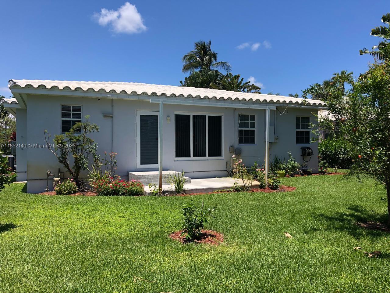 Exceptional opportunity east of US-1! This well-kept 2BR/1BA home sits on a large 8,723 sq ft corner lot just minutes from Downtown Hollywood, the beach, and the Broadwalk. Featuring a new roof (2025), new central A/C, updated floors, and a stylish kitchen with stainless steel appliances. The bathroom offers double sinks and tile finishes. Bright and inviting interiors with great natural light. Fenced yard with space for a pool, fruit trees, impact garage door, and private driveway. Vacant and listed for rent at $3,300. No HOA!. Unbeatable location near top schools, shopping, dining, and major routes—Florida living at its best!